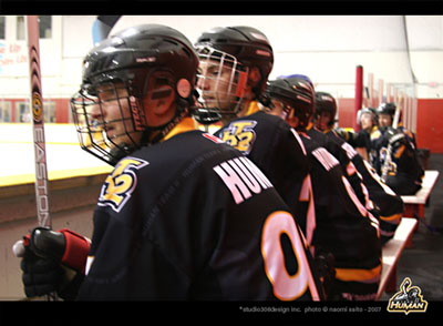 HT2 players showing jerseys on bench