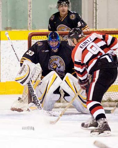 Dawson City Nuggets goalie getting ready for a save